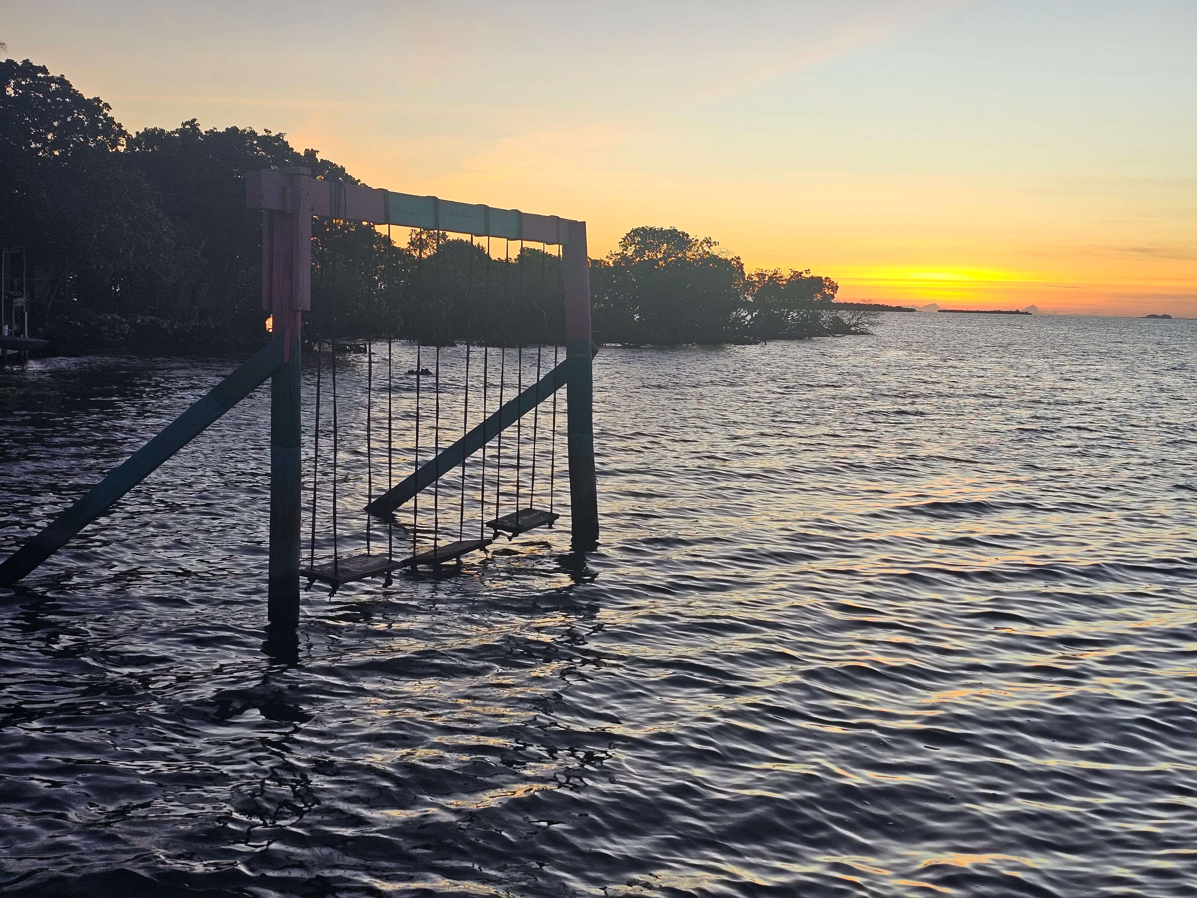 Sunset over-water swings